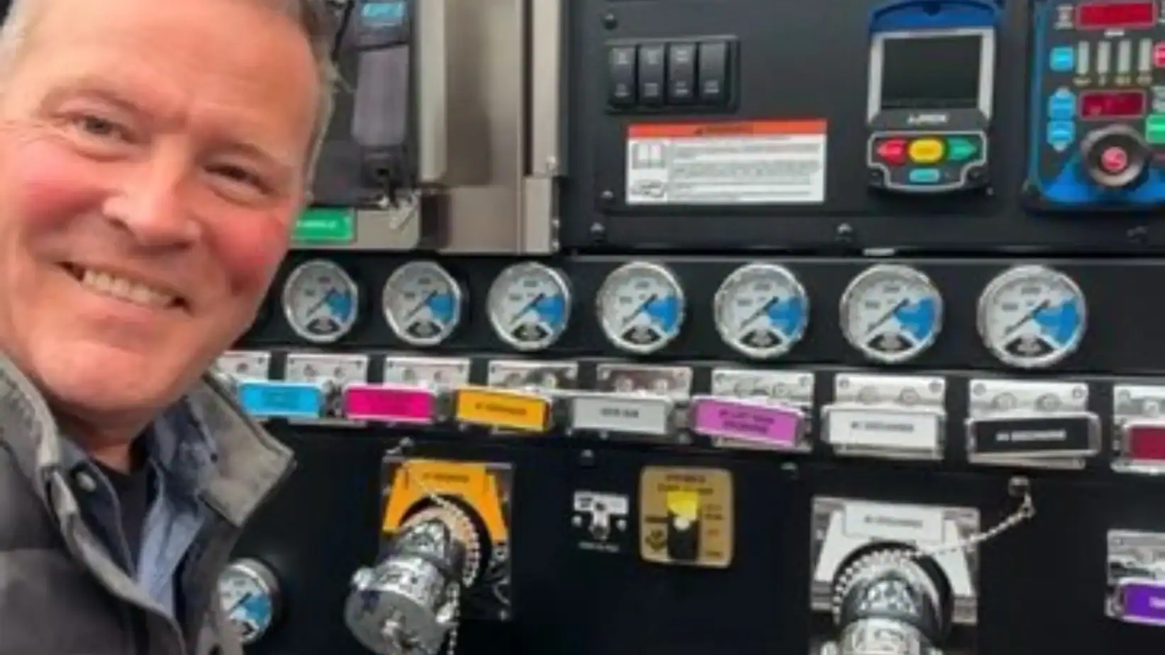 Robert of Grey Cap operating truck control panel—showcasing Local Expertise in emergency response logistics